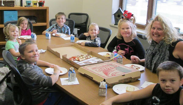 students having lunch with Mrs. Brock