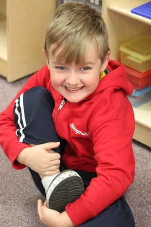 Montessori student smiling for picture