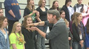 Go to An a cappella group serenades high school students