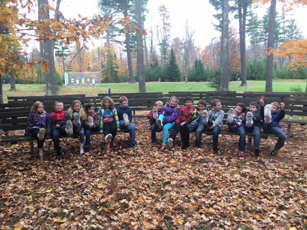 Students wore socks and walked through the woods to catch seeds and spores
