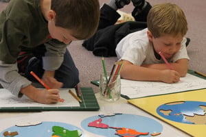 montessori students working on geography